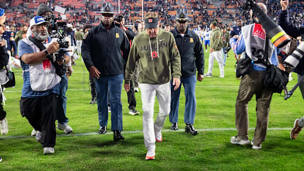 Auburn head coach Hugh Freeze walks off the field after Auburn lost to Kentucky