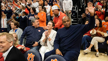 Former Auburn basketball player Charles Barkley acknowledges the crowd as Auburn Tigers take on USC Trojans at Neville Arena in Auburn, Ala., on Sunday, Dec. 17, 2023.
