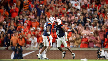 Auburn Tigers linebacker Robert Woodyard Jr. (0) celebrates his sack with defensive end Keldric Faulk (15) as Auburn Tigers take on Georgia Bulldogs at Jordan-Hare Stadium in Auburn, Ala. on Saturday, Oct. 11, 2025. Georgia Bulldogs defeated Auburn Tigers 20-10.