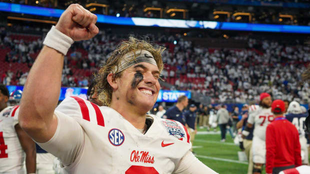 Mississippi Rebels quarterback Jaxson Dart celebrates after a victory 