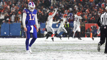 Josh Allen walks off the field after throwing an interception late in the Bills' loss to the Bengals