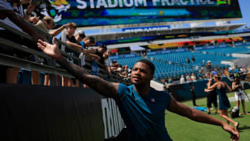 Jacksonville Jaguars cornerback Tyson Campbell (32) greets fans during the ninth day of an NFL football training camp practice Saturday, Aug. 3, 2024 at EverBank Stadium in Jacksonville, Fla. Today marked the first day of public practice inside the stadium.