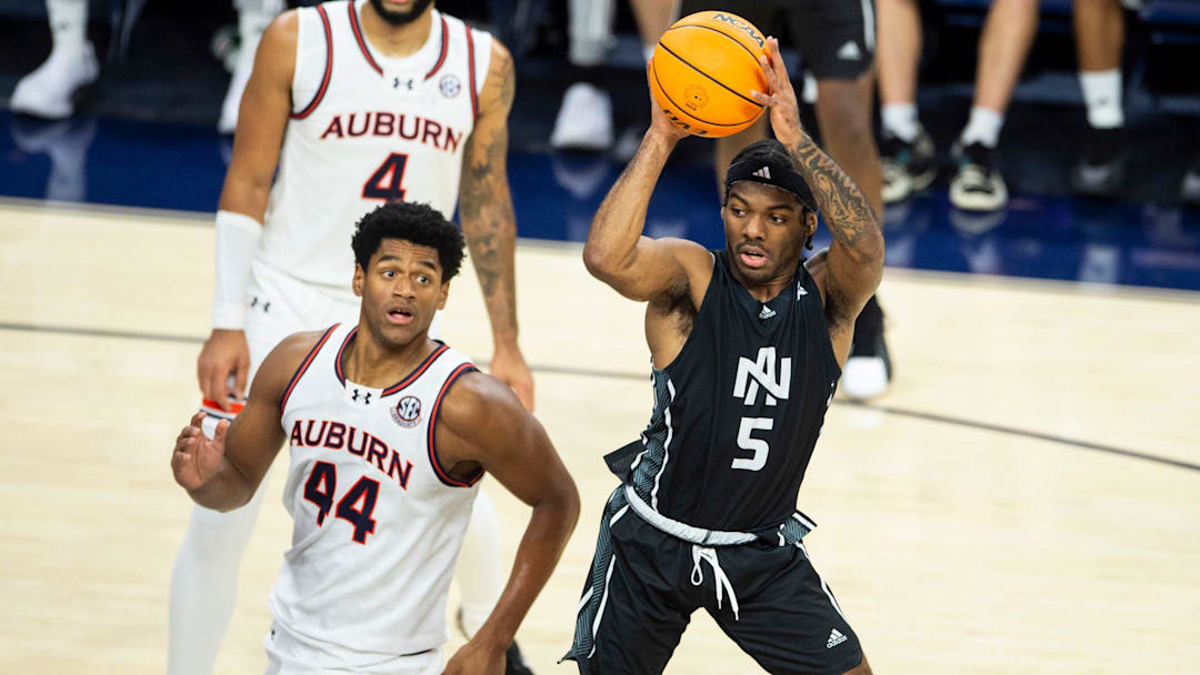 North Alabama guard Jacari Lane passes against Auburn at Neville Arena in Auburn, Ala., on Monday, Nov. 18, 2024. 