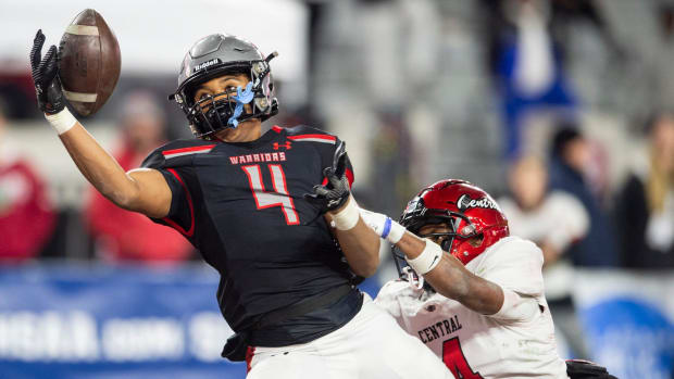 Central Phenix City's Monterrius Echols (4) is called for defensive pass interference on Thompson's Colben Landrew