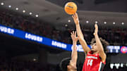 Georgia Bulldogs forward Asa Newell (14) takes a jump shot as Auburn Tigers take on Georgia Bulldogs at Neville Arena in Auburn, Ala., on Saturday, Feb. 22, 2025. Auburn Tigers lead Georgia Bulldogs 29-24 at halftime.