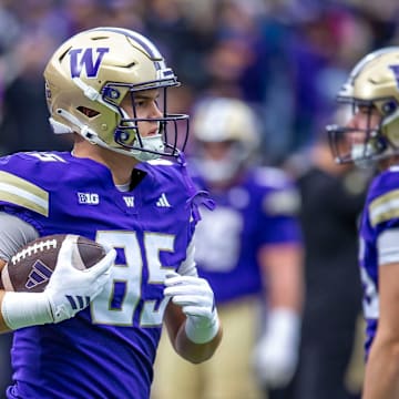 Baron Naone goes through warm-ups before facing Illinois.