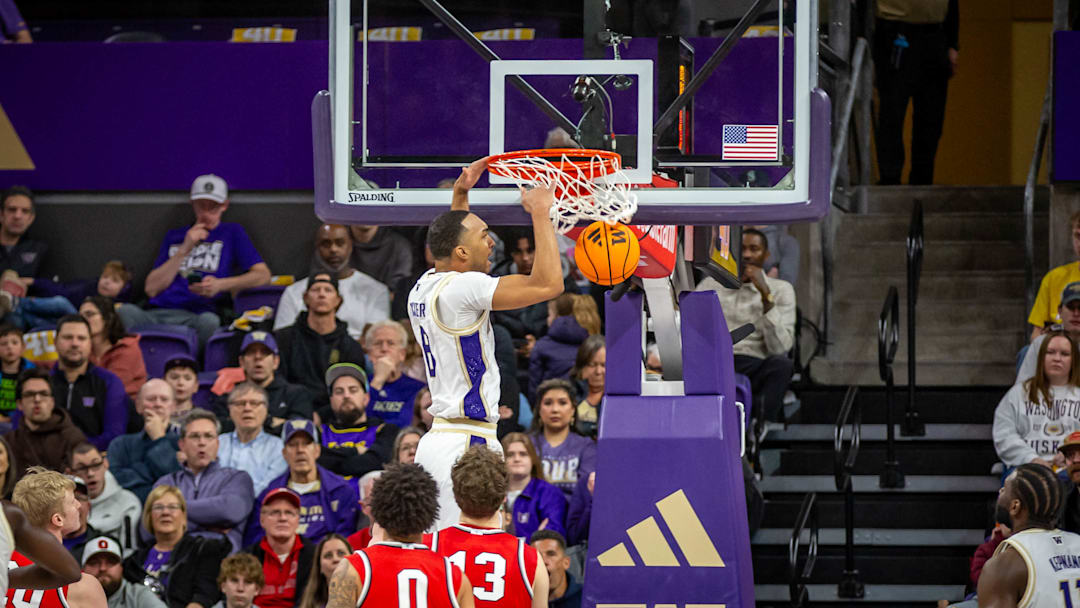 Bryson Tucker slams home a dunk after taking a lob pass.