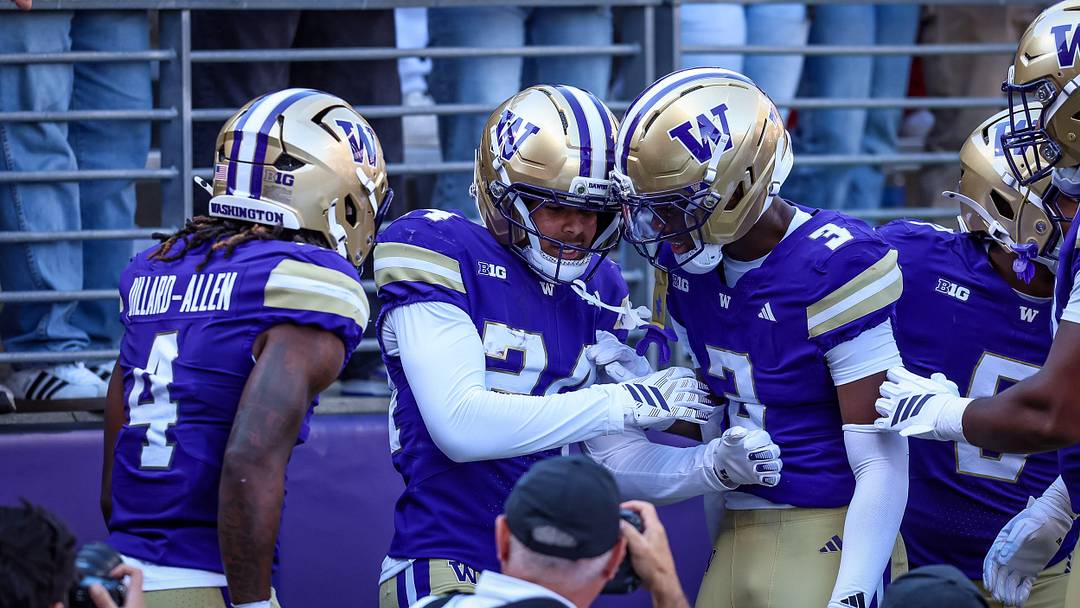 Jeron Jones is surrounded by fellow defensive backs after a big play in the Apple Cup. 