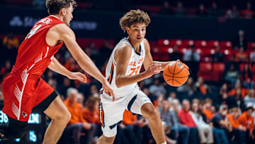 Illinois freshman guard Keaton Wagler (23) drives on an Illinois State defender in the Illini's 92-65 exhibition win over the Redbirds at State Farm Center in Champaign, Illinois.