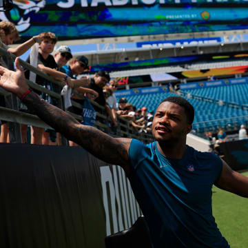 Jacksonville Jaguars cornerback Tyson Campbell (32) greets fans during the ninth day of an NFL football training camp practice Saturday, Aug. 3, 2024 at EverBank Stadium in Jacksonville, Fla. Today marked the first day of public practice inside the stadium.