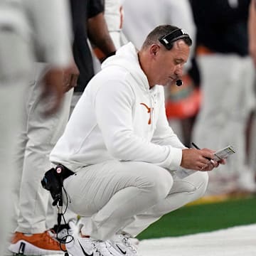 Texas Longhorns head coach Steve Sarkisian looks at his play sheet against Ohio State Buckeyes in the second quarter of the Cotton Bowl Classic during the College Football Playoff semifinal game at AT&T Stadium in Arlington, Texas on January, 10, 2025.