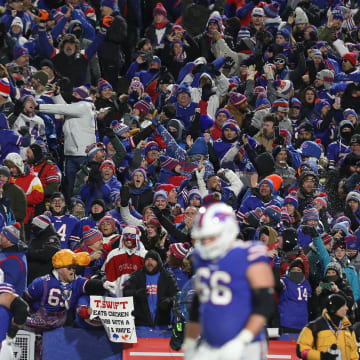 Bills fans cheer and throw snow in the air after QB Josh Allen scores a touchdown during the first half of the Bills divisional game against Kansas City Chiefs at Highmark Stadium in Orchard Park on Jan. 21, 2024.