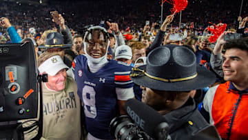 Auburn Tigers head coach Hugh Freeze and wide receiver Cam Coleman (8) hug after the game as Auburn Tigers take on Texas A&M Aggies at Jordan-Hare Stadium in Auburn, Ala., on Saturday, Sept. 7, 2024. Auburn Tigers defeated Texas A&M Aggies 43-41 in fourth overtime.