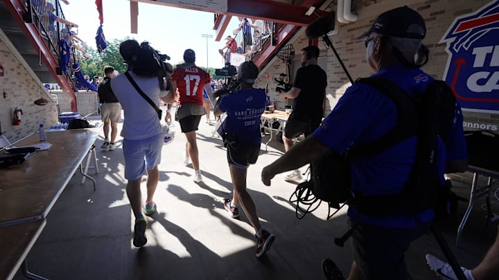 Buffalo Bills quarterback Josh Allen heads out to the field with the NFL film crew from Hard Knocks following behind him during opening day of the Buffalo Bills training camp at St. John Fisher University in Pittsford on July 23, 2025. Buffalo Bills quarterback Josh Allen heads out to the field with the NFL film crew from Hard Knocks following behind him during opening day of the Buffalo Bills training camp at St. John Fisher University in Pittsford on July 23, 2025.
