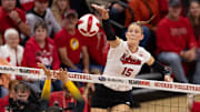 Nebraska middle blocker attacks against Iowa.