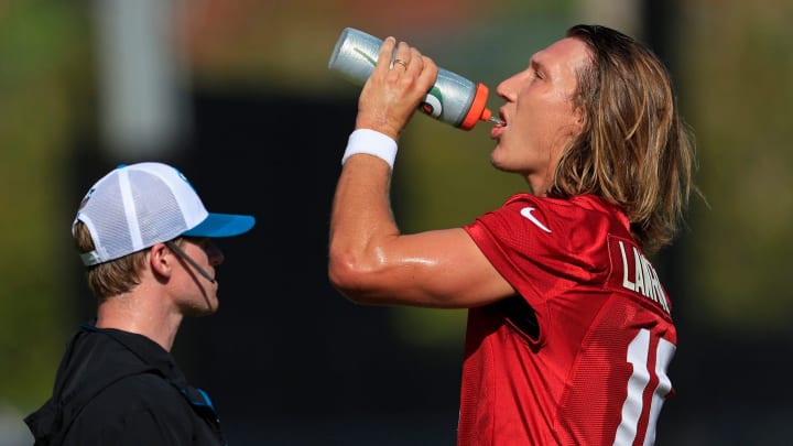 Jacksonville Jaguars quarterback Trevor Lawrence (16) hydrates during the first day of an NFL football training camp practice Wednesday, July 24, 2024 at EverBank Stadium’s Miller Electric Center in Jacksonville, Fla.