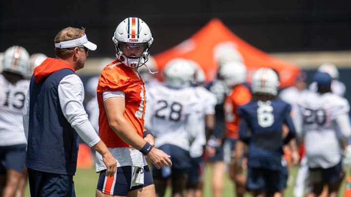 Auburn Tigers head coach Hugh Freeze talks with quarterback Jackson Arnold (11) during practice at Woltosz Football Performance Center in Auburn, Ala. on Thursday, Aug. 14, 2025.