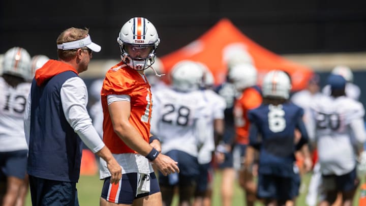 Auburn Tigers head coach Hugh Freeze talks with quarterback Jackson Arnold (11) during practice at Woltosz Football Performance Center in Auburn, Ala. on Thursday, Aug. 14, 2025.