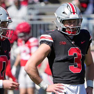 Ohio State Buckeye quarterbacks Julian Sayin (10) and Lincoln Kienholz (3) warm up before the start of the spring game at Ohio Stadium on April 12, 2025.