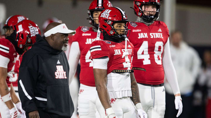 Jacksonville State Gamecocks running back Cam Cook (4) warms up as Troy Trojans take on Jacksonville State Gamecocks during the IS4S Salute to Veterans Bowl at Cramton Bowl in Montgomery, Ala. on Tuesday, Dec. 16, 2025.