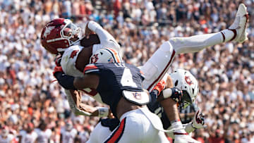 Arkansas Razorbacks quarterback Taylen Green (10) dives at the goal line and is stopped by Auburn Tigers safety Sylvester Smith (19) and defensive back Kayin Lee (4) as Auburn Tigers take on Arkansas Razorbacks at Jordan-Hare Stadium in Auburn, Ala., on Saturday, Sept. 21, 2024. Arkansas Razorbacks lead Auburn Tigers 7-0 at halftime.