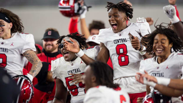 Central Phenix City's Cameron Coleman (8) celebrates with his team as Central Phenix City faces Thompson 