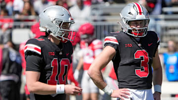 Ohio State Buckeye quarterbacks Julian Sayin (10) and Lincoln Kienholz (3) warm up before the start of the spring game at Ohio Stadium on April 12, 2025.
