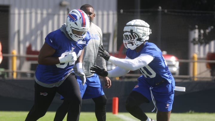 Bills Dawuane Smoot tries to get away from Von Miller during an edge drill.