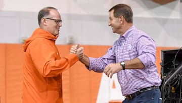 Clemson defensive coordinator Tom Allen greets head coach Dabo Swinney on the way to speaking during the Clemson Club football National Signing Day wrap up presented by Clemson Seneca Chick-Fil-A at the Poe Indoor Practice Facility at Clemson University in Clemson, S.C. Feb 5, 2025.