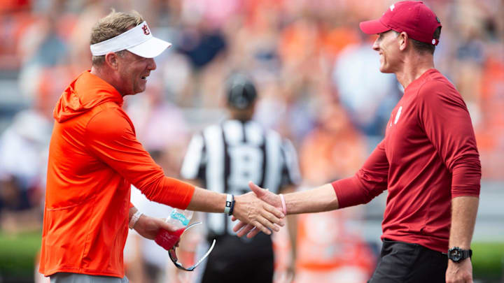 Auburn Tigers head coach Hugh Freeze and Oklahoma Sooners head coach Brent Venables shake hands during warm ups before Auburn Tigers take on Oklahoma Sooners at Jordan-Hare Stadium in Auburn, Ala., on Saturday, Sept. 28, 2024.