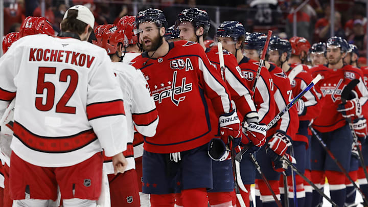 Washington Capitals right wing Tom Wilson leads Capitals players in the handshake line with the Carolina Hurricanes.