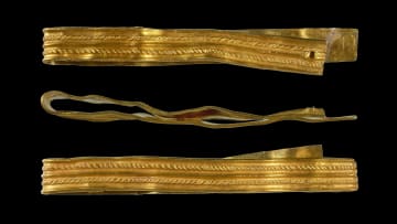 Three views of the gold Roman-era bracelet discovered in a West Sussex field.
