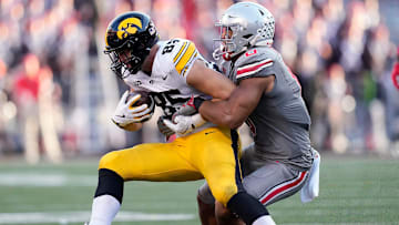 Oct 5, 2024; Columbus, OH, USA; Ohio State Buckeyes linebacker Cody Simon (0) tackles Iowa Hawkeyes tight end Luke Lachey (85) after a catch in the third quarter during the NCAA football game at Ohio Stadium.
