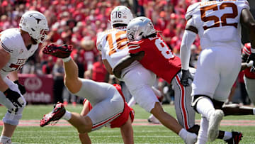 Ohio State Buckeyes linebacker Arvell Reese tackles Texas Longhorns quarterback Arch Manning on a run at The Shoe. 