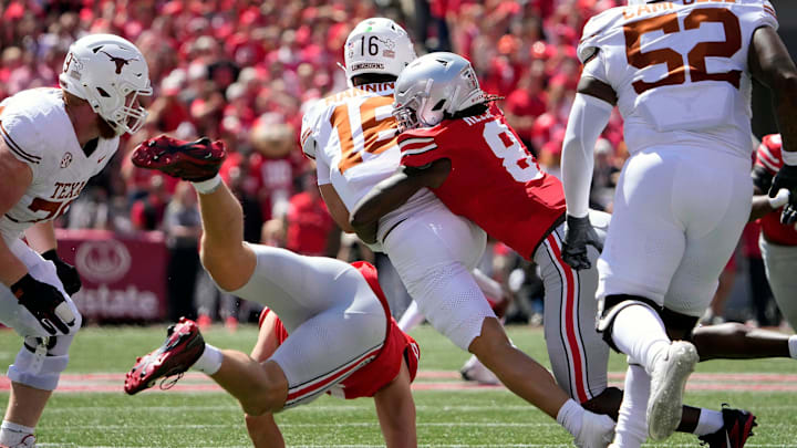 Ohio State Buckeyes linebacker Arvell Reese tackles Texas Longhorns quarterback Arch Manning on a run at The Shoe. Ohio State Buckeyes linebacker Arvell Reese tackles Texas Longhorns quarterback Arch Manning on a run at The Shoe.