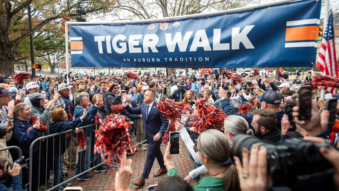 Auburn football head coach Alex Golesh is welcomed during a Tiger Walk at Jordan-Hare Stadium in Auburn, Ala. on Monday, Dec. 1, 2025.