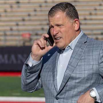 Rutgers Football Coach Greg Schiano talks on phone as he watches the early part of  Rumson Fair Haven Caldwell game. Rumson-Fair Haven football loses to Caldwell 18-14 in state title game

Fbcwrf221204hhh