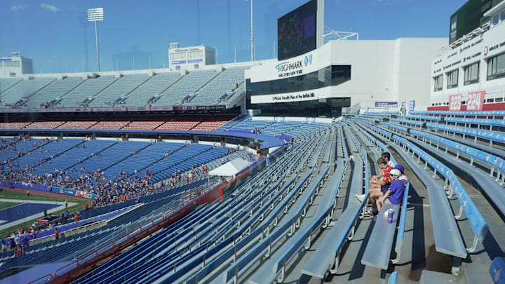 A couple of fans are alone in their section as they wait for the start of the Return of the Blue & Red practice at Highmark Stadium in Orchard Park on Aug.1, 2025.