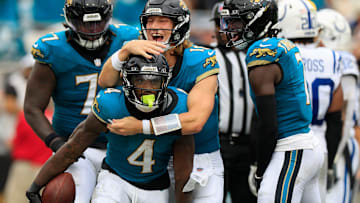 Jacksonville Jaguars quarterback Trevor Lawrence (16) celebrates a touchdown scored by running back Tank Bigsby (4) during the third quarter of NFL football matchup Sunday, Oct. 6, 2024 at EverBank Stadium in Jacksonville, Fla. The Jaguars edged the Colts on a field goal 37-34.