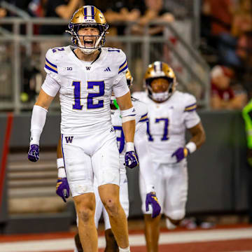 Alex McLaughlin celebrates his 47-yard interception return for a touchdown in the Apple Cup. 