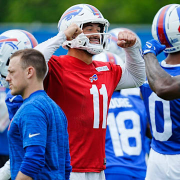 Buffalo Bills Mitchell Trubisky and Tyrell Shavers go through an elaborate handshake 