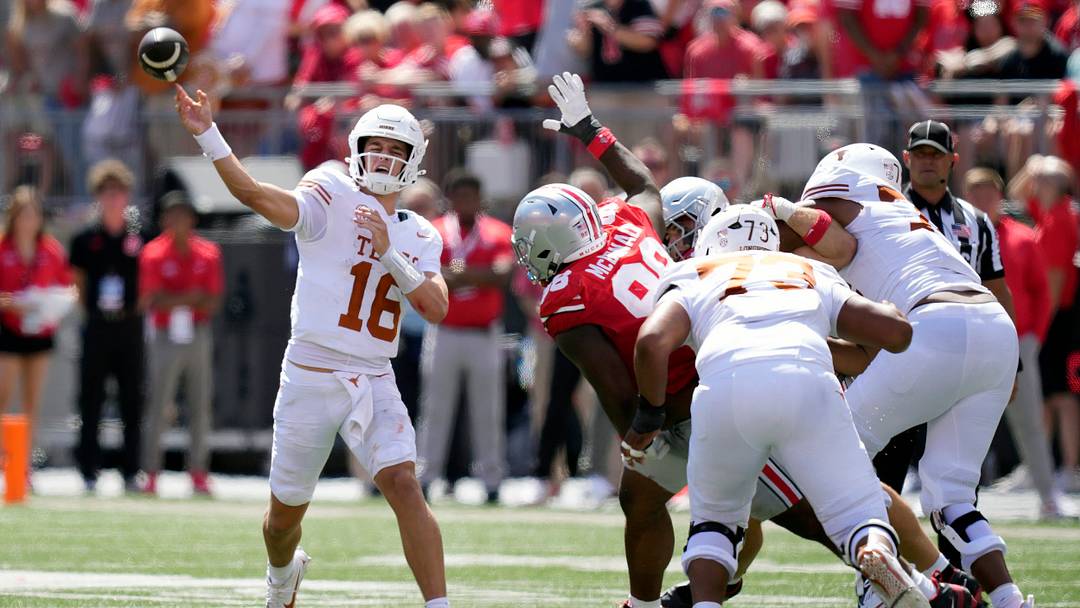 Texas Longhorns quarterback Arch Manning (16) throws an interception to Ohio State Buckeyes cornerback Jermaine Mathews Jr. (7) in the third quarter of their game at Ohio Stadium in Columbus, Ohio on Aug 30, 2025.