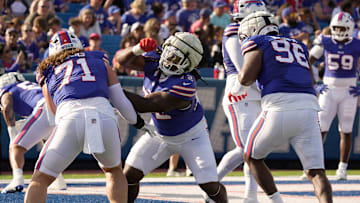 Buffalo Bills defensive tackle Marcus Harris pushes works on getting by defensive tackle Casey Rogers and defensive tackle Deone Walker during the Return of the Blue & Red practice at Highmark Stadium in Orchard Park on Aug.1, 2025.