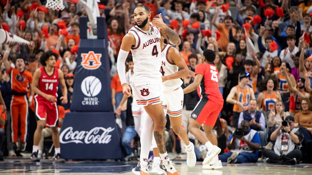 Auburn Tigers forward Johni Broome (4) celebrates a three-pointer as Auburn Tigers take on Georgia Bulldogs at Neville Arena in Auburn, Ala., on Saturday, Feb. 22, 2025. Auburn Tigers lead Georgia Bulldogs 29-24 at halftime.