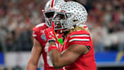 Ohio State Buckeyes running back Quinshon Judkins (1) celebrates his touchdown run against Texas Longhorns in the fourth quarter of the Cotton Bowl Classic during the College Football Playoff semifinal game at AT&T Stadium in Arlington, Texas on January, 10, 2025.