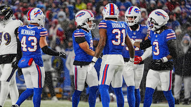 Bills defensive players huddle during a AFC divisional round playoff game against the Ravens.
