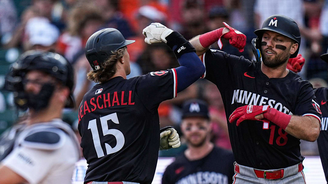 Minnesota Twins second base Luke Keaschall (15), left, celebrates after batting 2-run home run against Detroit Tigers during the first inning at Comerica Park in Detroit in Tuesday, August 5, 2025.
