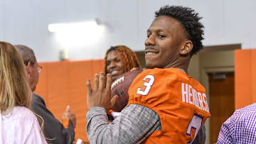 Clemson receiver Marquise Henderson (3) tosses a ball to a child who came with his family to the Clemson Club football National Signing Day wrap up presented by Clemson Seneca Chick-Fil-A at the Poe Indoor Practice Facility at Clemson University in Clemson, S.C. Feb 5, 2025.