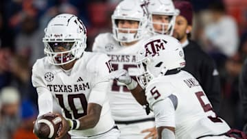 Texas A&M Aggies quarterback Marcel Reed (10) hands the ball off to running back Amari Daniels (5) during warm ups before Auburn Tigers take on Texas A&M Aggies at Jordan-Hare Stadium in Auburn, Ala., on Saturday, Sept. 7, 2024.