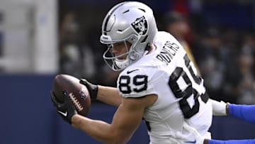 Oct 20, 2024; Inglewood, California, USA; Las Vegas Raiders tight end Brock Bowers (89) catches a pass against Los Angeles Rams cornerback Ahkello Witherspoon (4) in the first half at SoFi Stadium. Mandatory Credit: Alex Gallardo-Imagn Images